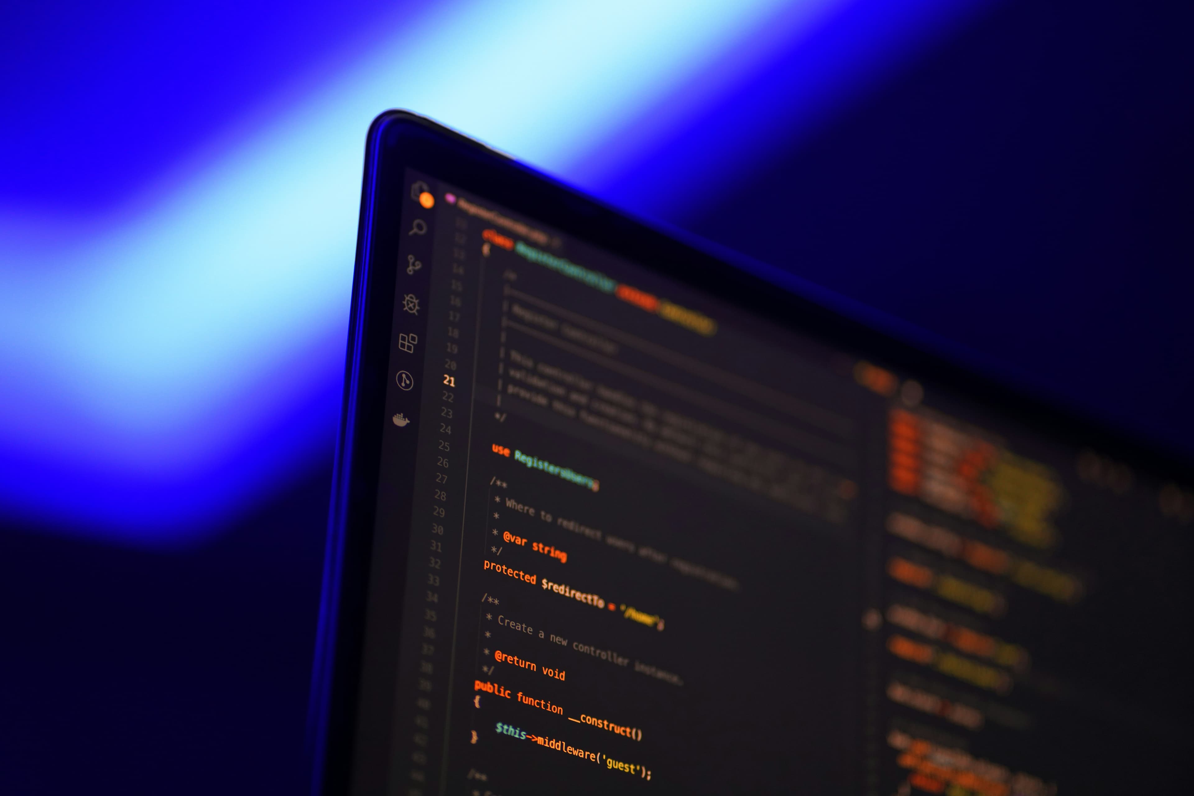 Blue-lit laptop screen with a software editor open