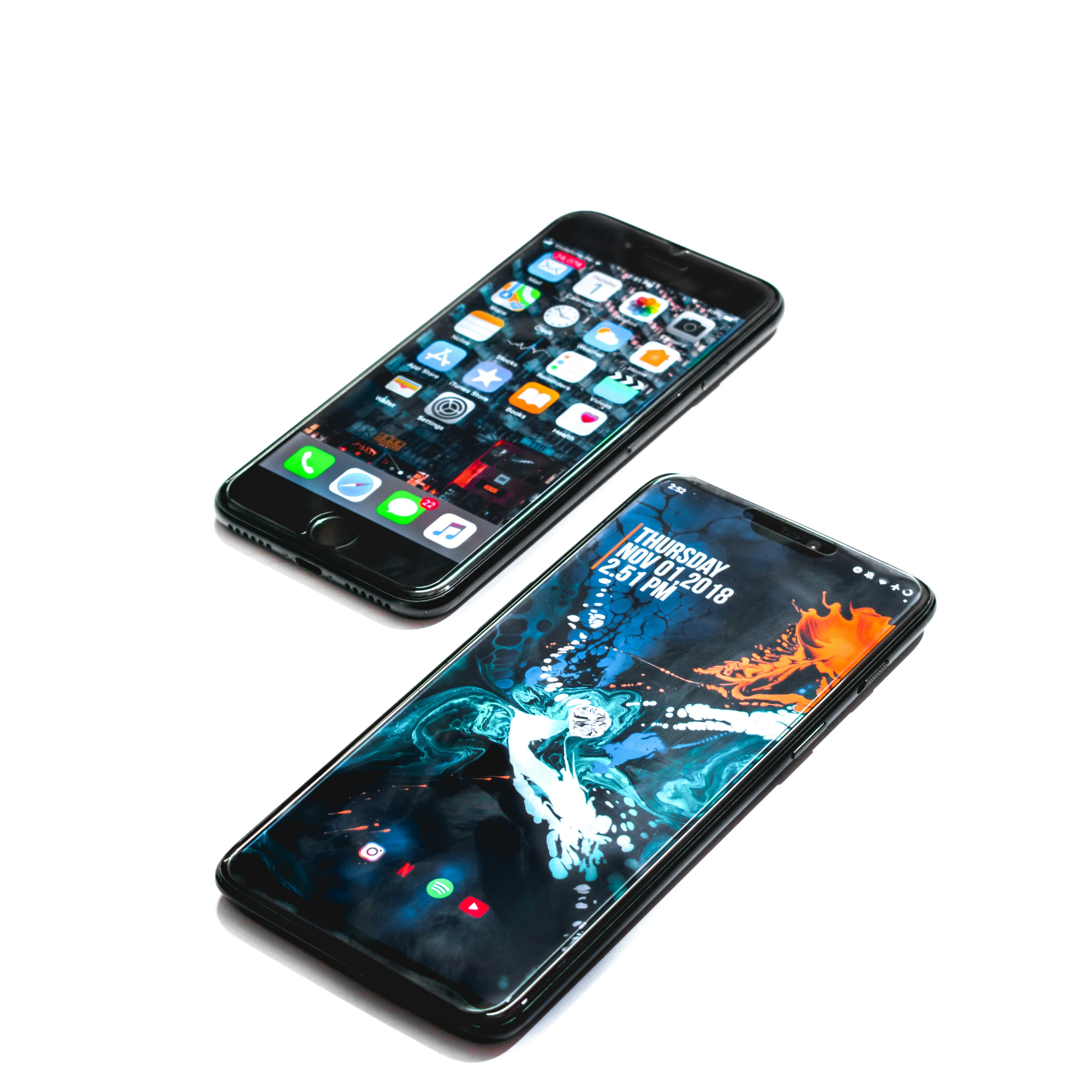Two smartphones showing different mobile interfaces on a white background